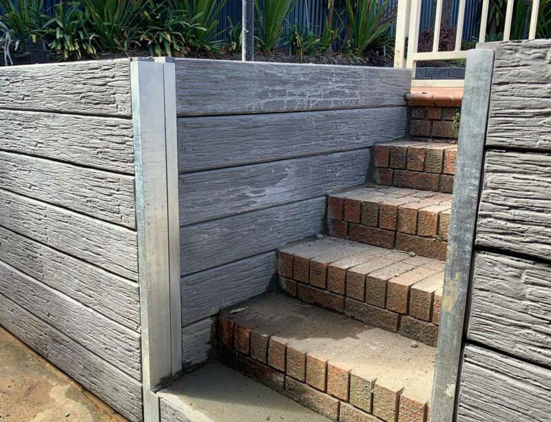 concrete retaining wall with steel post